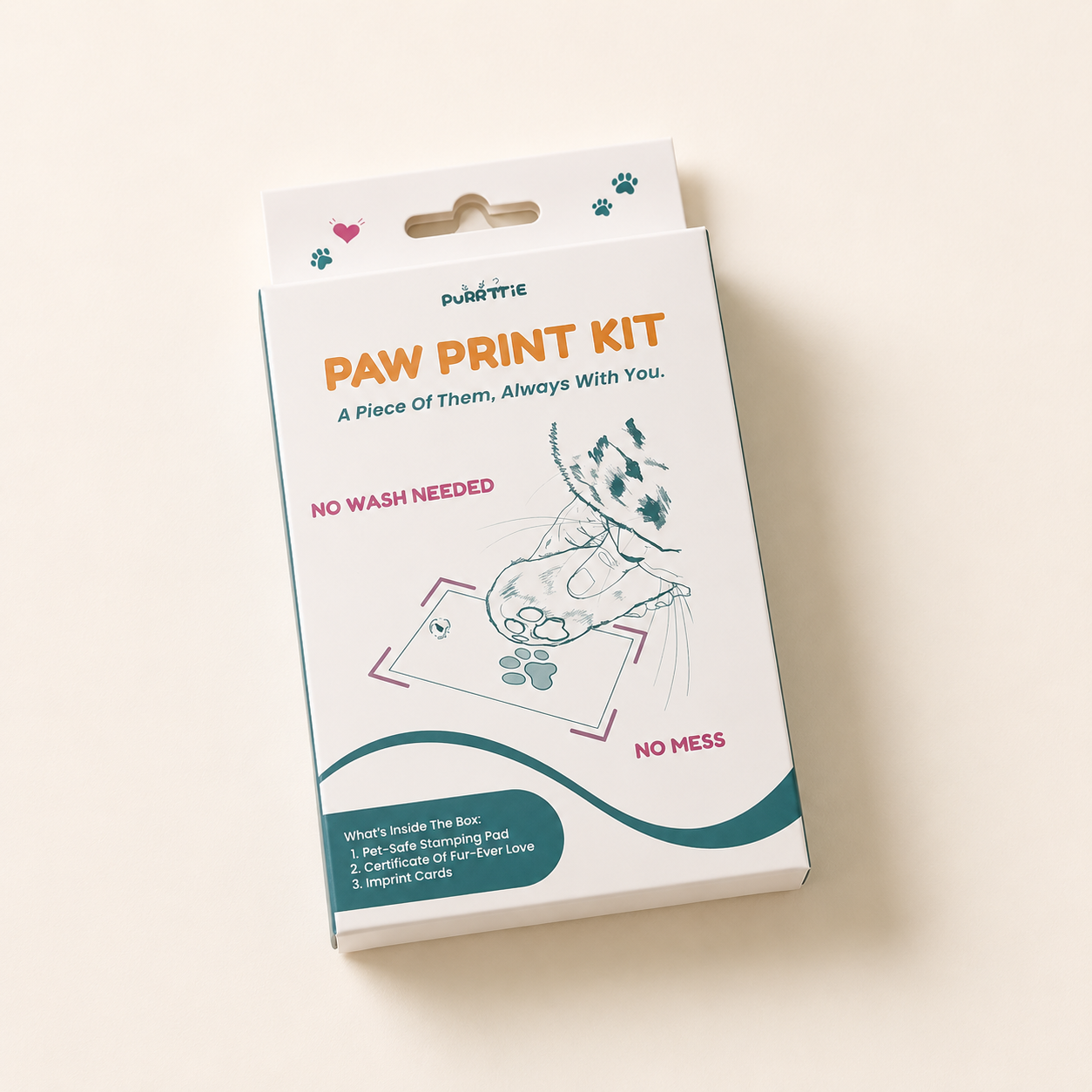 Purrttie No Mess Paw Print Kit packaging — white box with teal and orange branding, cat illustration pressing paw onto imprint card, labeled "No Wash Needed" and "No Mess." Kit contents listed: pet-safe stamping pad, Certificate of Fur-Ever Love, imprint cards.