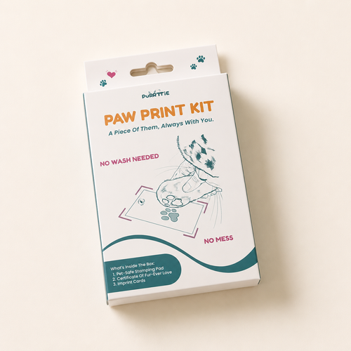Purrttie No Mess Paw Print Kit packaging — white box with teal and orange branding, cat illustration pressing paw onto imprint card, labeled "No Wash Needed" and "No Mess." Kit contents listed: pet-safe stamping pad, Certificate of Fur-Ever Love, imprint cards.