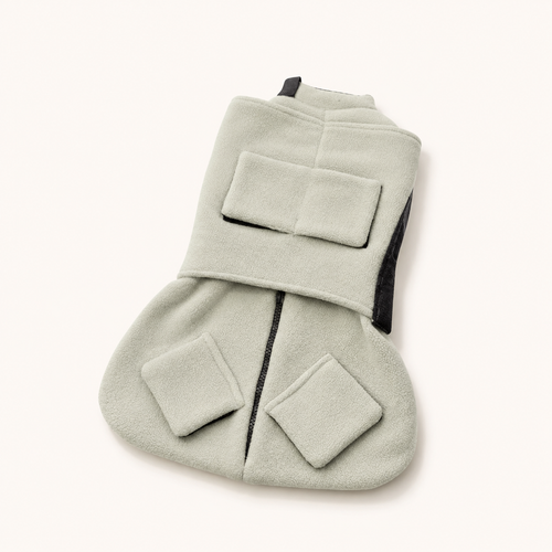 Purrttie Snug Pro Cat Wrap in grey — soft polar fleece cat grooming wrap with adjustable velcro collar and dual-head zipper, folded flat to show the calming swaddle design used for nail trims, medication, and vet visits.